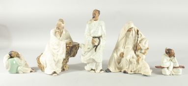 FIVE CRACKLE GLAZE POTTERY FIGURES, various sizes, (5).