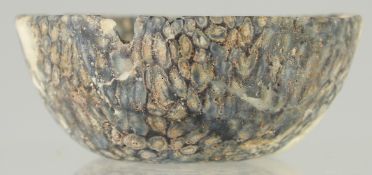A RARE EARLY ISLAMIC MOSAIC GLASS BOWL, (af), 9.5cm diameter.
