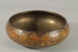 A FINE 19TH CENTURY INDIAN KASHMIRI LACQUERED PAPIER MACHE BOWL with brass inteiror, 23cm diameter.
