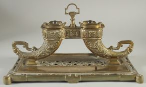 A CHINESE BRASS INKWELL ON RECTANGULAR BASE, 30.5cm long.