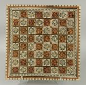 A FINE CIRCA 1920'S SYRIAN DAMASCUS MOTHER OF PEARL AND BONE INLAID WOODEN CHESS BOARD, 40cm
