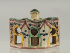 A 19TH CENTURY MOROCCAN LIDDED POTTERY INKWELL, 7.5cm wide.