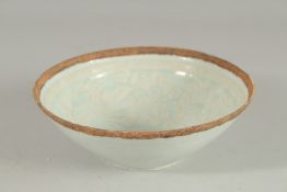 A CHINESE CELADON GLAZE CARVED POTTERY BOWL, with raised foliate decoration to the interior, 18cm
