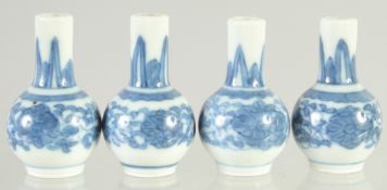 FOUR SMALL CHINESE BLUE AND WHITE MINIATURE VASES, each with four-character mark to base, 4cm