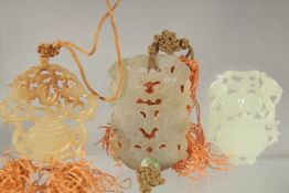 THREE CHINESE CARVED JADE PENDANTS.