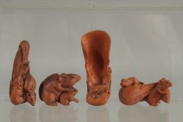 FOUR JAPANESE BOXWOOD NETSUKES, (4).