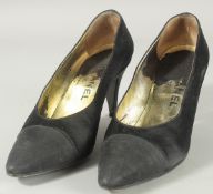 A PAIR OF CHANEL BLACK FABRIC SHOES in a Chanel box. Size 37.5.