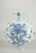 A CHINESE BLUE AND WHITE TWIN HANDLE MOON FLASK with dragon to each side. 28ins high.