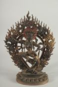 A TIBETAN BRONZE FIGURE OF A DEITY with detachable halo. 29ins high.
