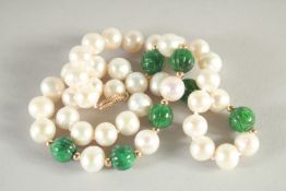 A 14CT GOLD PEARL AND JADE NECKLACE. 16ins long.
