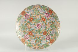 AN ORIENTAL PORCELAIN DISH. 16ins high.