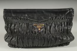 A PRADA SOFT BLACK LEATHER HAND BAG. 11ins long, 8ins high. with dust bag.