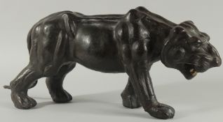 A LEATHER TIGER 21ins long.