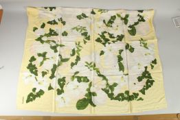 A CHANEL SILK SCARF yellow with white flowers, with original Chanel envelope. 92cm x 92cm.