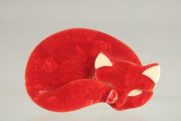 A LEA STERN OF PARIS RED SLEEPING CAT BROOCH. Red made in three tiers.