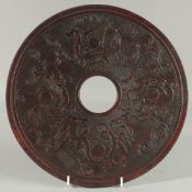 A LARGE CARVED CHINESE JADE DISC carved on both sides. 11.5ins diameter.
