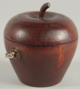 A WOODEN APPLE TEA CADDY. 4.5ins high.