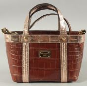 A GOOD DOLCE AND GABBANA BLACK CROCODILE OR SNAKE SKIN BAG. 9ins long, 7ins high, in a dust bag.