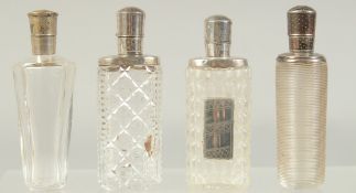 FOUR GOOD 19TH CENTURY FRENCH SILVER MOUNTED GLASS SCENT BOTTLES.
