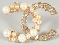 A CHANEL DOUBLE C BROOCH.