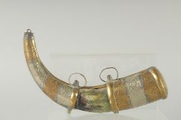 AN EARLY ISLAMIC HORN AND BRASS MOUNTED POWDER HORN. 10ins long.