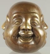 A BRASS FOUR FACES BUDDHA. 4.5ins high.