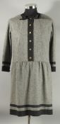 A CHANEL GREY DRESS, with black trim and bow, Chanel double C buttons. Size label removed, approx.