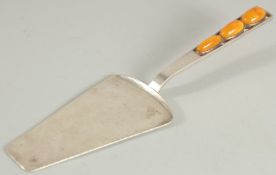 AN .830 BALTIC SILVER AND AMBER CAKE SLICE. 8.75ins long.