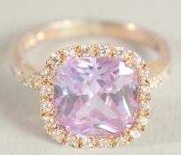 A SILVER AMETHYST C Z RING.