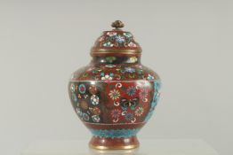A CLOISONNE ENAMEL VASE AND COVER. 5.5ins high.