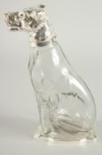 A GOOD SILVER PLATED GLASS 'DOG' CLARET JUG with blue eyes. 10ins high.