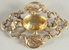 A LARGE VICTORIAN YELLOW GOLD AND TOPAZ SET BROOCH.