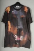 A GIVENCHY T SHIRT. Size XS.