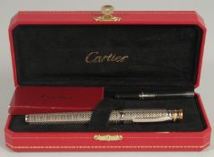 A CARTIER PEN AND REFILS, boxed with papers.