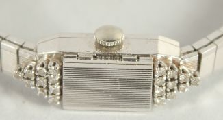 A 14CT WHITE GOLD, DIAMOND SET LA FEMME COCKTAIL WATCH.