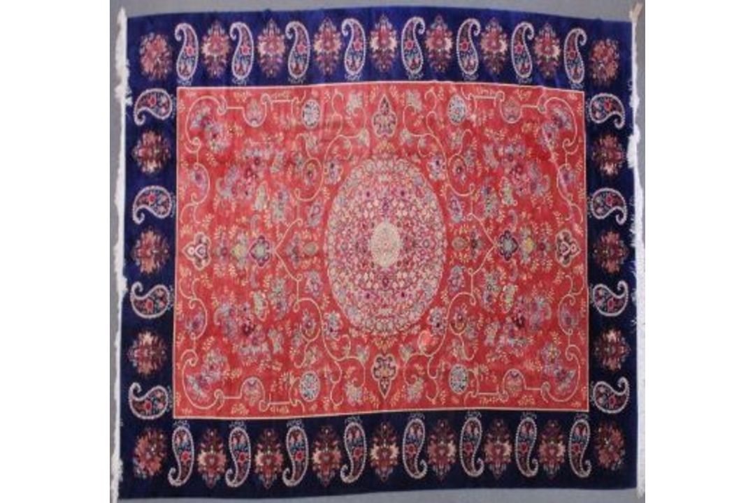A VERY GOOD ISLAMIC CARPET, 20TH CENTURY, salmon pink with a rich blue border, having an allover - Image 1 of 3
