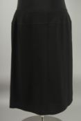 A CHANEL BLACK SKIRT, 100% wool with silk lining. Size 46 with Chanel hanger.