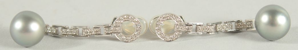 A PAIR OF 18CT WHITE GOLD ART DECO DIAMOND AND GREY SOUTH SEA PEARL EARRINGS.
