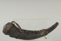 A VERY EARLY LEATHER CLAD POWDER HORN. 10ins long.