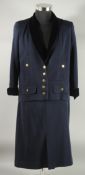 A CHANEL NAVY BLUE TWO PIECE SKIRT SUIT. Size 42 with velvet trim to jacket and gilt Chanel