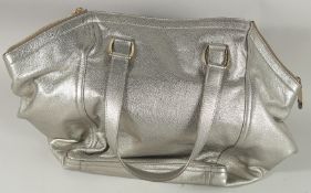 A GOOD YVES ST. LAURENT SILVER / METALLIC LEATHER BAG. 18ins long overall, 12ins high.