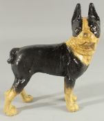 A CAST IRON BLACK AND WHITE BULLDOG 8ins high.