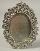 A GOOD RUSSIAN SILVER OVAL PHOTOGRAPH FRAME with scrolled mount. 7ins x 5ins. Mark, 84, Head.