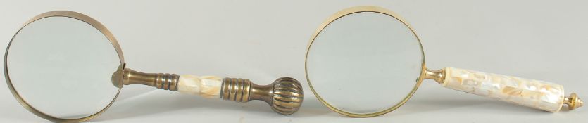 TWO MAGNIFYING GLASSES with mother of pearl handles.