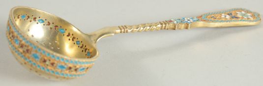A GOOD RUSSIAN SILVER AND COLOURED ENAMEL SIFTER SPOON. 6.5ins long.