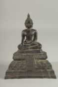 A THAI BRONZE FIGURE. 7ins high.