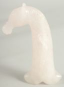 A GOOD CARVED ROCK CRYSTAL DAGGER HANDLE 'HORSE'S HEAD'. 5.25ins long.