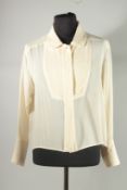 A CHANEL CREAM SILK BLOUSE, dress shirt front and double cuffs. Size label worn, approx. UK 14. Some