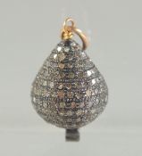 A SMALL RUSSIAN GOLD TOP DIAMOND EGG PENDANT. 2cm long.