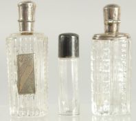 THREE SILVER TOP SCENT BOTTLES.